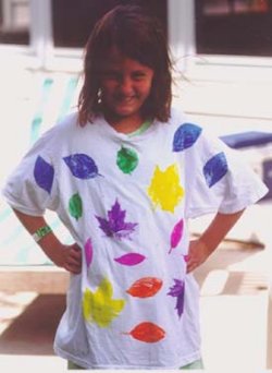 Child with leaf print t-shirt